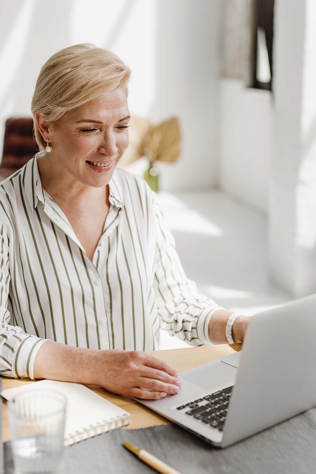 women using SMS marketing software in laptop